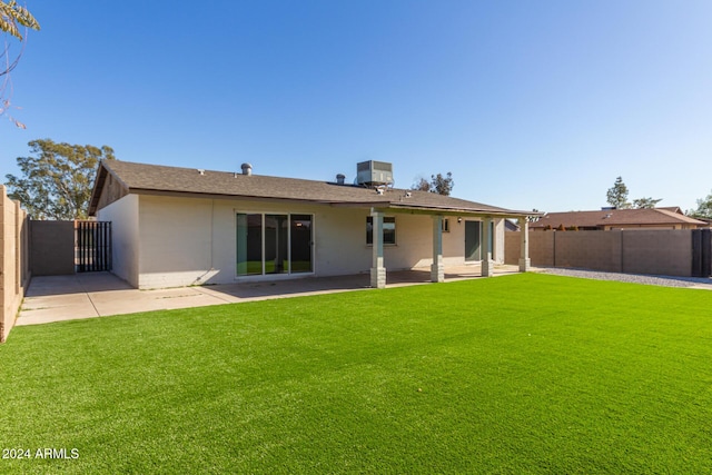 4302 N 80th Ln, Phoenix, AZ 85033 - back of property with a patio, stucco siding, and cooling unit
