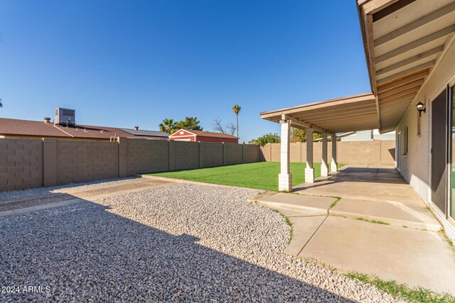 4302 N 80th Ln, Phoenix, AZ 85033 - view of yard featuring a patio and central air condition unit