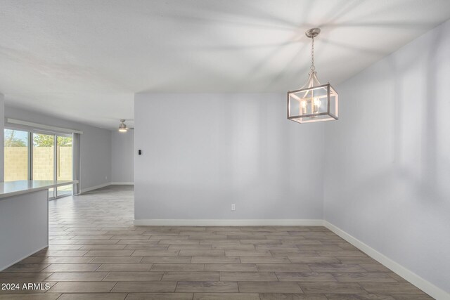 4302 N 80th Ln, Phoenix, AZ 85033 - empty room with wood finished floors and baseboards