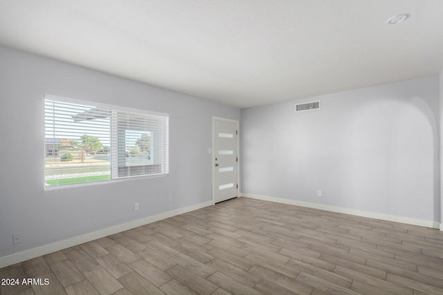 4302 N 80th Ln, Phoenix, AZ 85033 - empty room with wood finished floors and baseboards