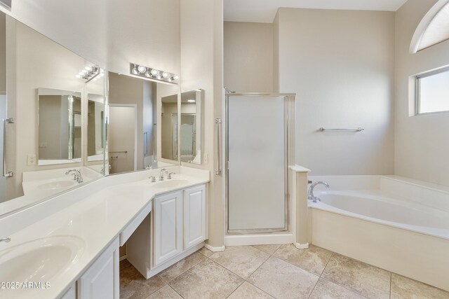 bathroom with a bath, a sink, and a shower stall