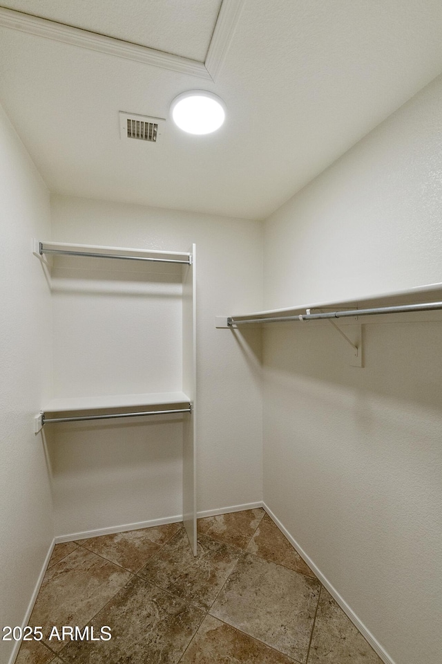walk in closet with visible vents