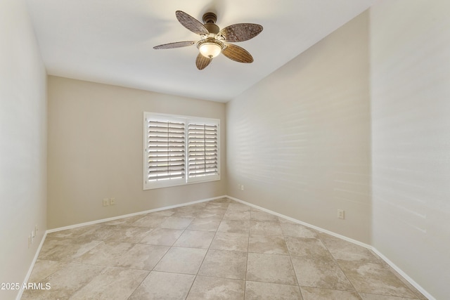 spare room featuring baseboards, a ceiling fan, and light tile patterned floors