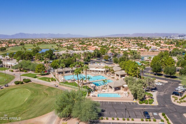 aerial view featuring a water and mountain view, a residential view, and view of golf course