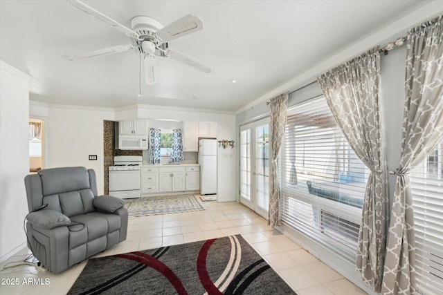 12501 E Cloud Rd, Chandler, AZ 85249 - living room with french doors, light tile patterned floors, ceiling fan, and ornamental molding
