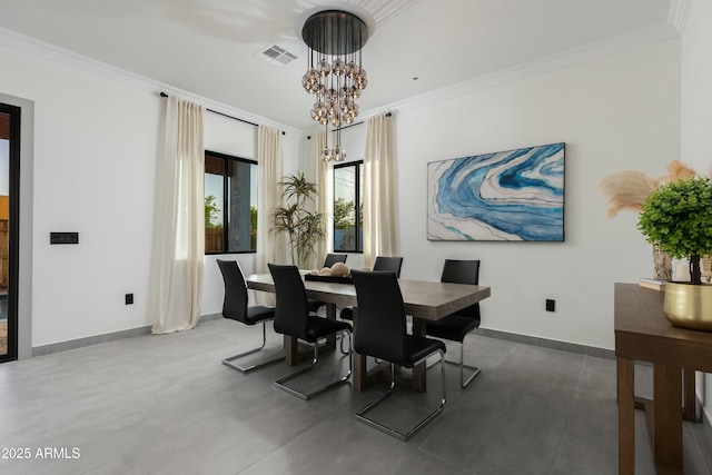 dining space with ornamental molding, visible vents, and an inviting chandelier