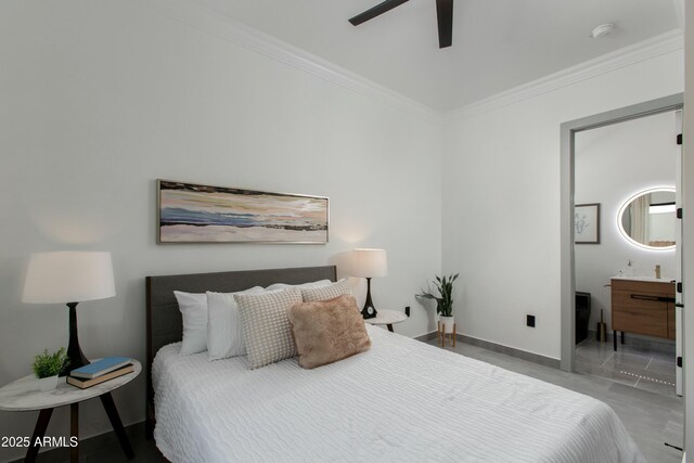 bedroom featuring ensuite bathroom, ceiling fan, ornamental molding, and baseboards