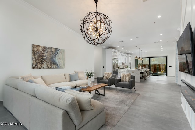 living room with recessed lighting, an inviting chandelier, and crown molding