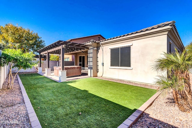 rear view of property featuring stucco siding, a fenced backyard, a pergola, and a hot tub