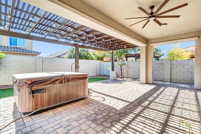 view of patio featuring a fenced backyard and a hot tub