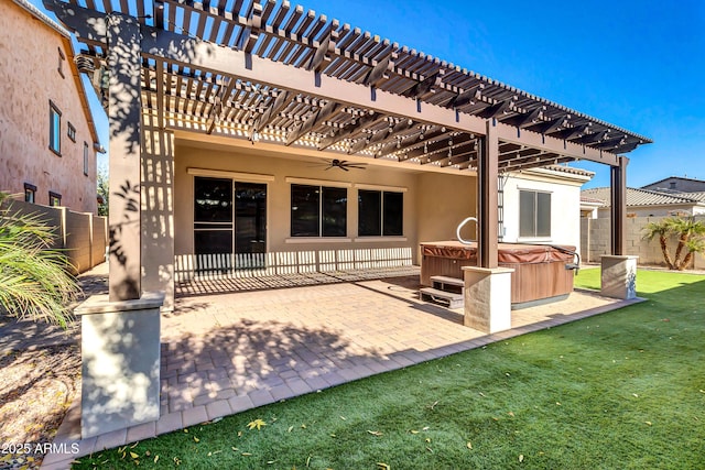 back of property featuring a lawn, a pergola, a patio, a fenced backyard, and a hot tub