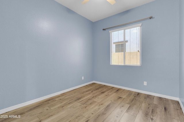 unfurnished room with light wood finished floors, ceiling fan, and baseboards