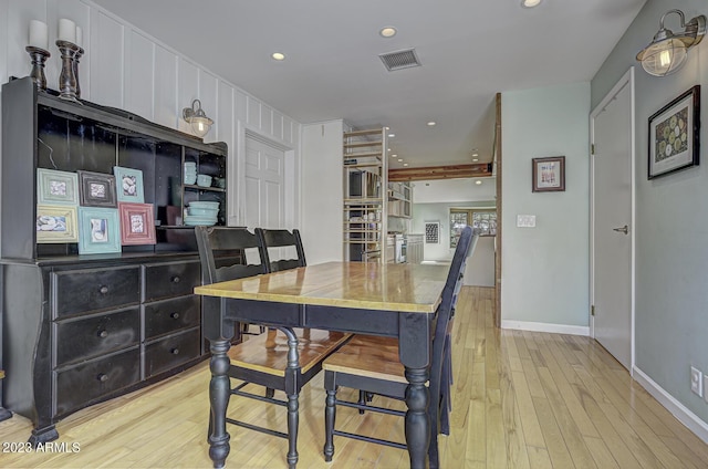 dining area with light wood-type flooring