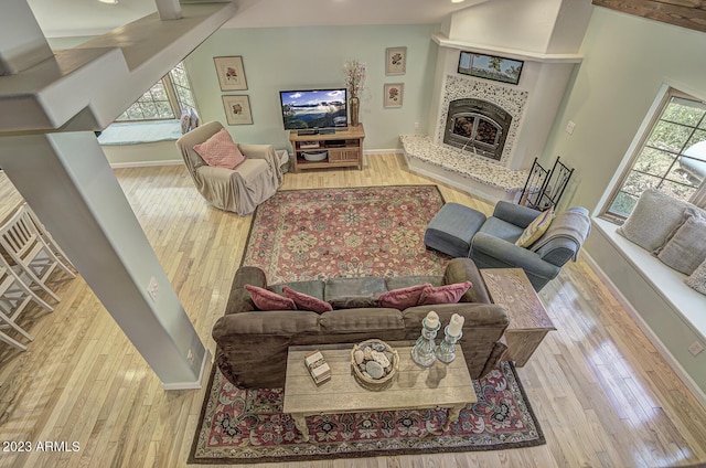 living room featuring hardwood / wood-style flooring and a fireplace