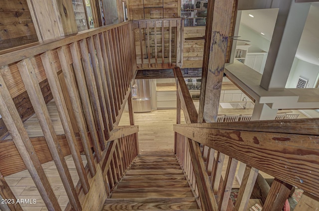 staircase with wood-type flooring