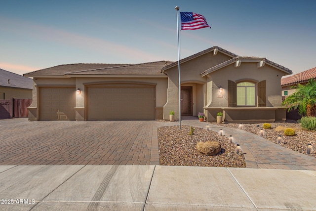1036 W Siebold Tree Ave, Queen Creek, AZ 85140 - view of front of house with driveway, stucco siding, a garage, and a tile roof