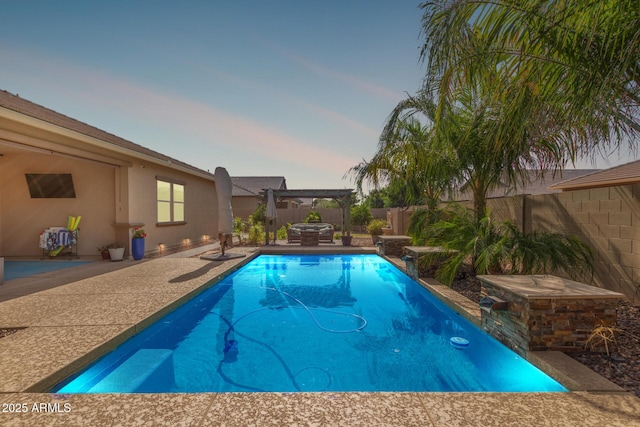 1036 W Siebold Tree Ave, Queen Creek, AZ 85140 - pool at dusk featuring a pergola, a fenced backyard, and a patio