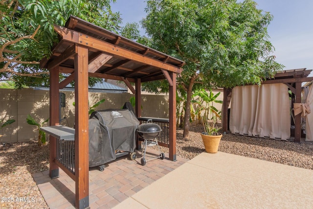 1036 W Siebold Tree Ave, Queen Creek, AZ 85140 - fenced backyard with a gazebo, a patio area, and grilling area