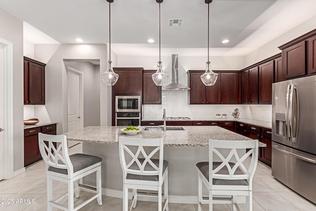 1036 W Siebold Tree Ave, Queen Creek, AZ 85140 - kitchen with stainless steel appliances, wall chimney exhaust hood, decorative backsplash, a sink, and light tile patterned floors