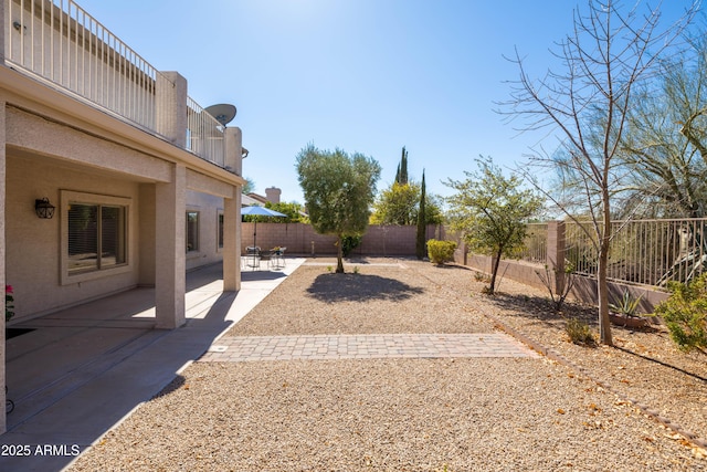 view of yard with a patio and a fenced backyard