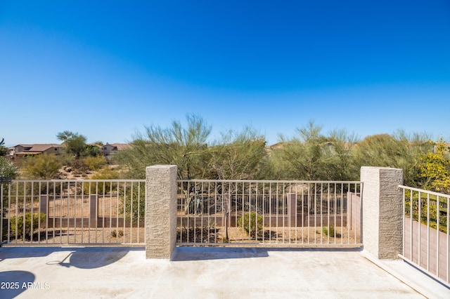 view of gate with fence