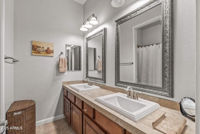 5813 E Ashler Hills Dr, Cave Creek, AZ 85331 - bathroom featuring double vanity, baseboards, and a sink