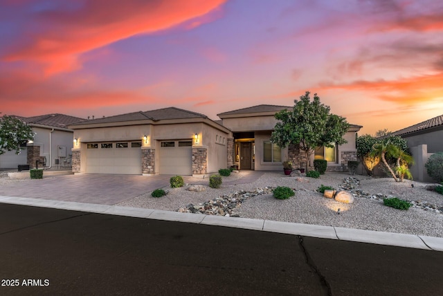 5813 E Ashler Hills Dr, Cave Creek, AZ 85331 - view of front of home featuring a garage, stucco siding, stone siding, and decorative driveway