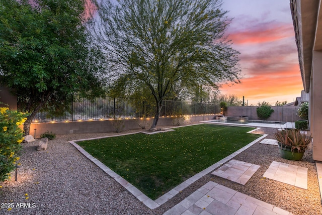 5813 E Ashler Hills Dr, Cave Creek, AZ 85331 - yard at dusk featuring a patio area and a fenced backyard