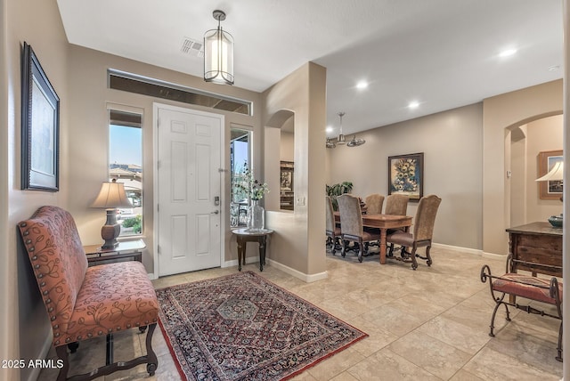 5813 E Ashler Hills Dr, Cave Creek, AZ 85331 - foyer entrance featuring arched walkways, visible vents, and baseboards