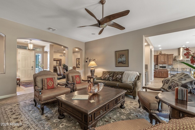 5813 E Ashler Hills Dr, Cave Creek, AZ 85331 - living area featuring recessed lighting, visible vents, a ceiling fan, arched walkways, and baseboards