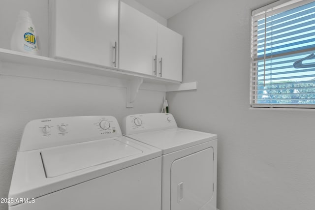 laundry area with cabinet space and washing machine and clothes dryer