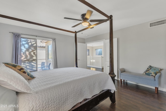 bedroom featuring visible vents, baseboards, ceiling fan, and wood finished floors