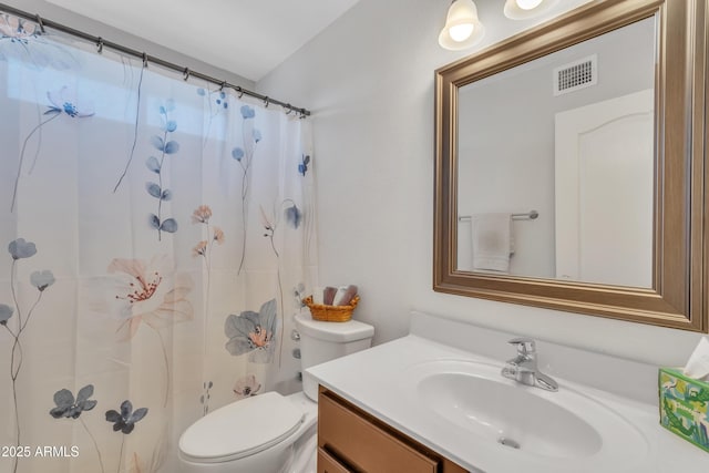 bathroom featuring visible vents, toilet, vanity, and a shower with curtain