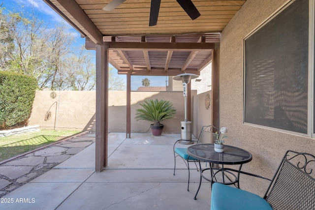 view of patio featuring a fenced backyard and ceiling fan