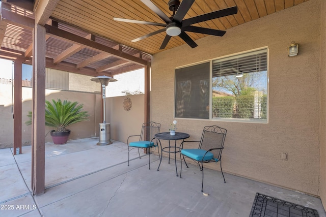 view of patio / terrace with a pergola and a ceiling fan