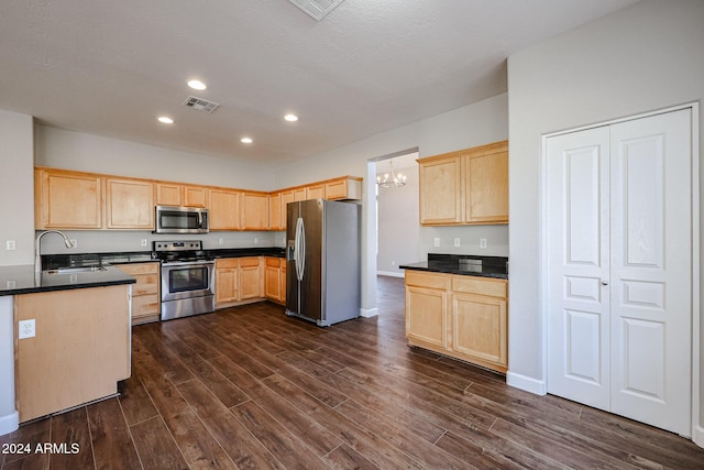 kitchen with sink, stainless steel appliances, dark wood-type flooring, a notable chandelier, and light brown cabinetry