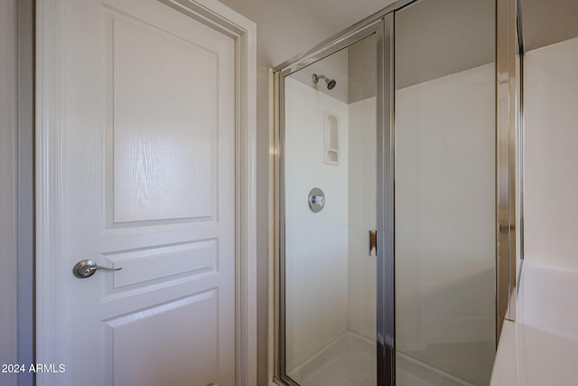 bathroom featuring an enclosed shower