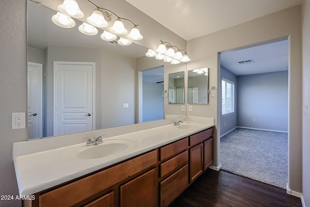 bathroom featuring hardwood / wood-style floors and vanity