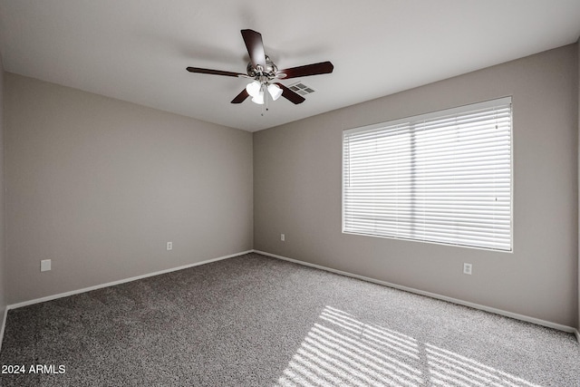 carpeted empty room with ceiling fan