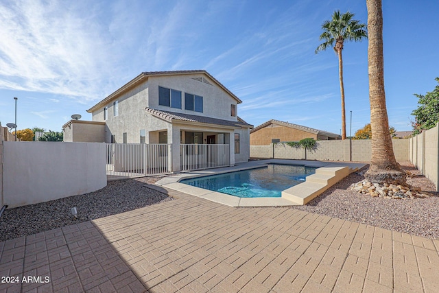 view of swimming pool featuring a patio area