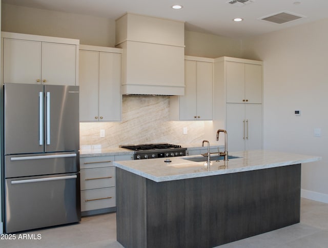 12863 E Cochise Rd, Scottsdale, AZ 85259 - kitchen featuring freestanding refrigerator, stove, tasteful backsplash, light stone countertops, and white cabinets