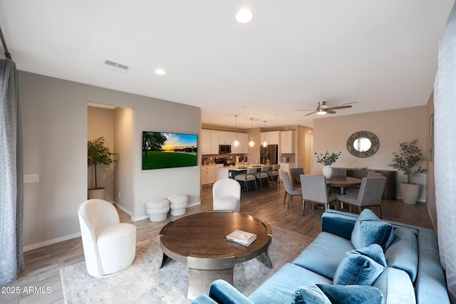 738 W Kingman Dr, Casa Grande, AZ 85122 - living area with recessed lighting, visible vents, ceiling fan, light wood-type flooring, and baseboards