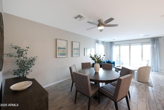 738 W Kingman Dr, Casa Grande, AZ 85122 - dining room with light wood-style floors, baseboards, visible vents, and ceiling fan