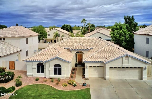 mediterranean / spanish house featuring a garage