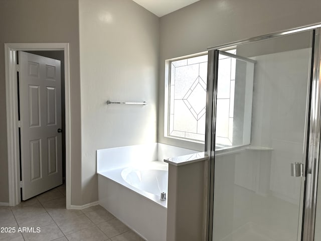 bathroom with tile patterned floors and independent shower and bath