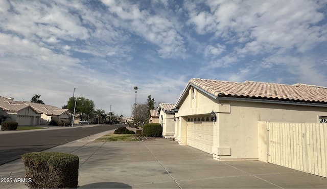 view of side of home featuring a garage