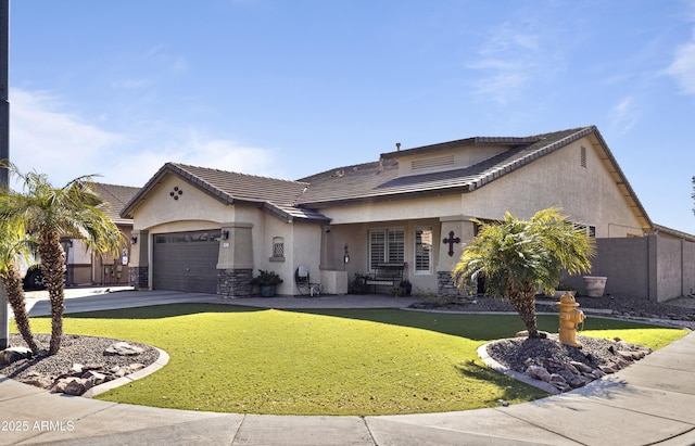 view of front of home featuring a garage and a front lawn