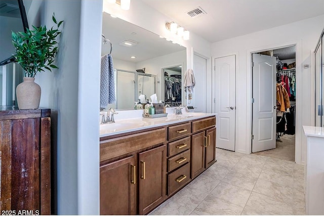 32047 N 125th Ave, Peoria, AZ 85383 - full bathroom featuring a stall shower, double vanity, and a spacious closet
