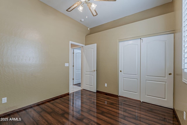 1391 W Windhaven Ave, Gilbert, AZ 85233 - unfurnished bedroom featuring dark wood-style flooring, a closet, ceiling fan, and baseboards