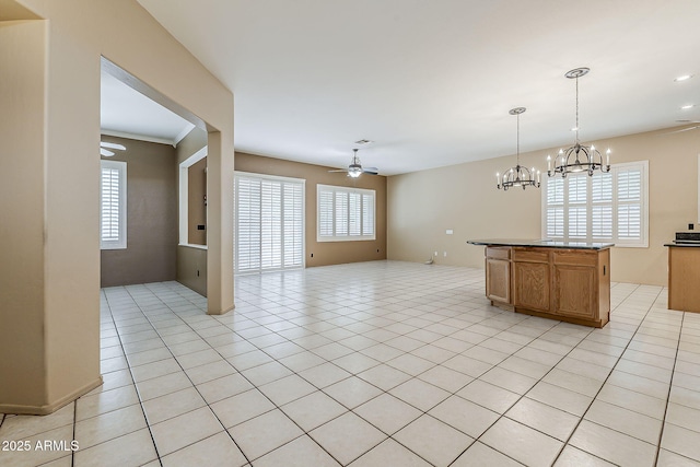 1391 W Windhaven Ave, Gilbert, AZ 85233 - kitchen featuring ceiling fan, decorative light fixtures, a chandelier, light tile patterned flooring, and open floor plan